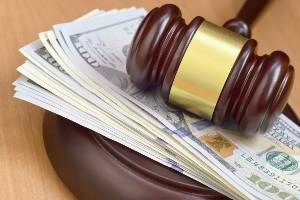How much is a divorce in Huntsville Alabama? Money and Gavel on the table